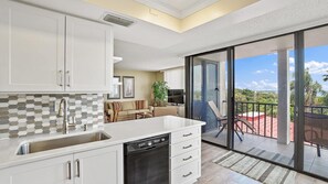 Condo, 2 Bedrooms | Private kitchen | Oven, dishwasher, dining tables - Bahia Del Mar by Sandy Beach Vacation Rentals (St. Petersburg)