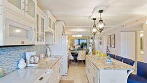 Condo, 2 Bedrooms | Private kitchen - Sand Caslte by Sandy Beach Vacations (Indian Shores)