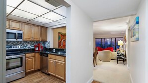 Condo, 2 Bedrooms | Private kitchen | Oven, dishwasher, dining tables - Ocean Sands 1107 by Sandy Beach Vacations (Madeira Beach)