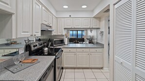Condo, 3 Bedrooms | Private kitchen | Oven, dishwasher, dining tables - Villa Madeira 605 by Sandy Beach Vacations (Madeira Beach)