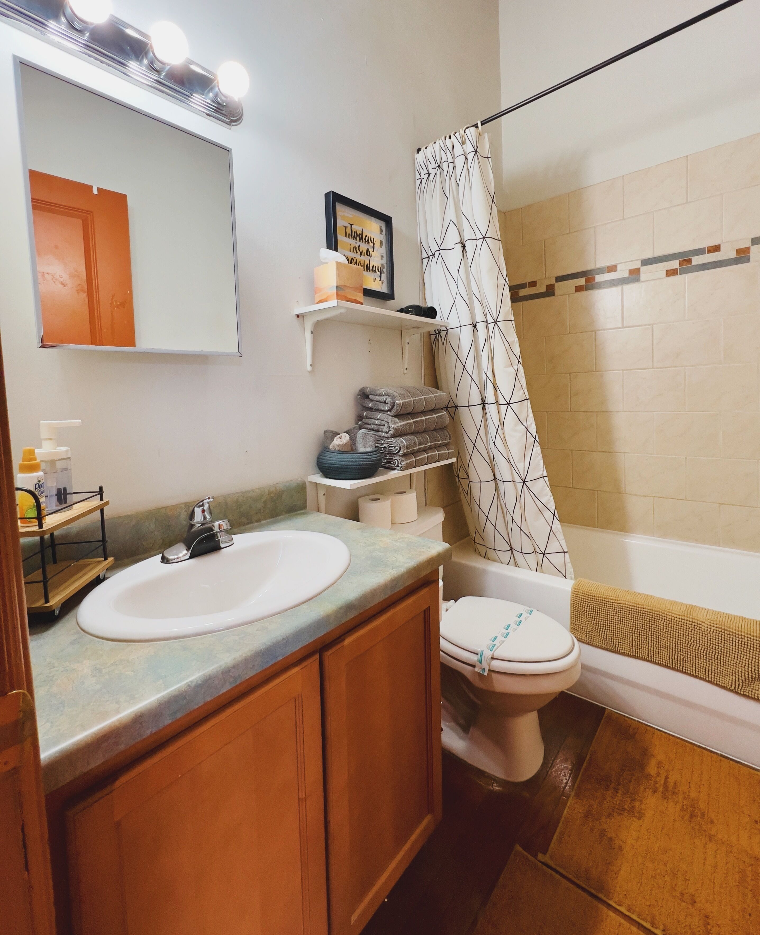Combined shower/tub, hair dryer, towels, soap