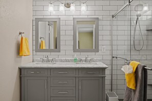 Combined shower/bathtub, hair dryer, towels, soap