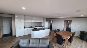 A spacious, well-equipped kitchen and dining area perfect for families and groups.