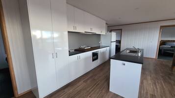 Fully equipped kitchen with plenty of space to prepare meals during your stay.