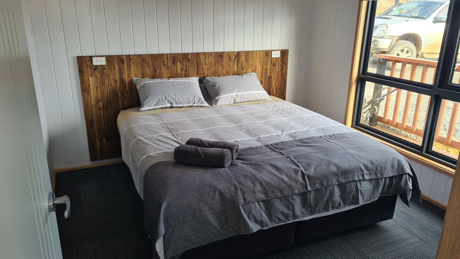 Comfortable king bedroom with a peaceful bushland setting.