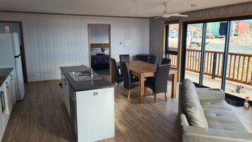 Bright open-plan living and dining area with beautiful views and plenty of space to relax.