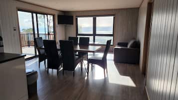 Bright open-plan living and dining area with beautiful views