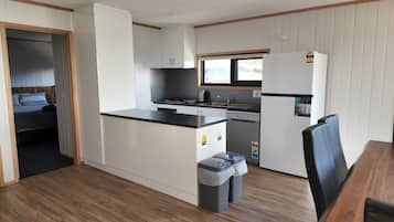 Fully equipped kitchen with adjoining dining area