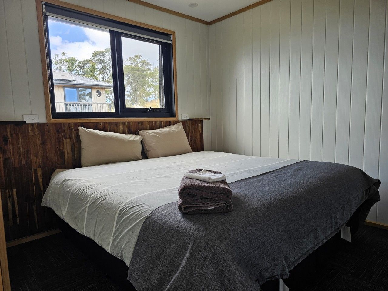 Bright and comfortable bedroom with a relaxing bushland outlook.