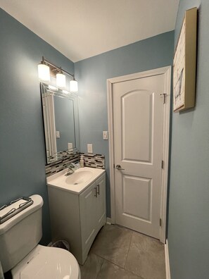 Combined shower/tub, hair dryer, towels, soap