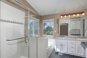 Combined shower/tub, hair dryer, towels, soap