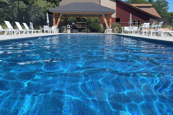 Outdoor pool with party grill and barbecue area