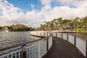 Walk along the boardwalk surrounded by lush greenery and enjoy the serene views of the lake.