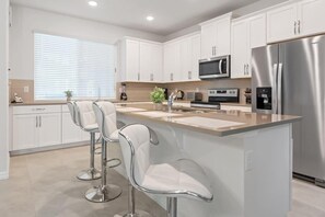 Fridge, microwave, oven, stovetop - Orlando Adventure Awaits: 4BR Townhouse (Kissimmee)