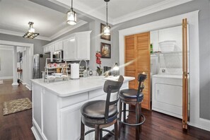 Enjoy cooking in this well-equipped kitchen with a central island and oven.