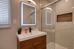 Combined shower/bathtub, hair dryer, towels, soap
