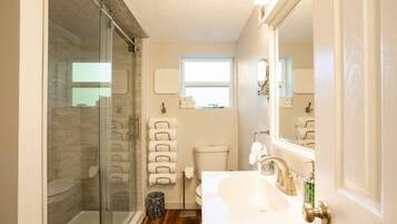 Shower, hair dryer, towels, soap