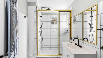 Bathtub, hair dryer, towels, soap
