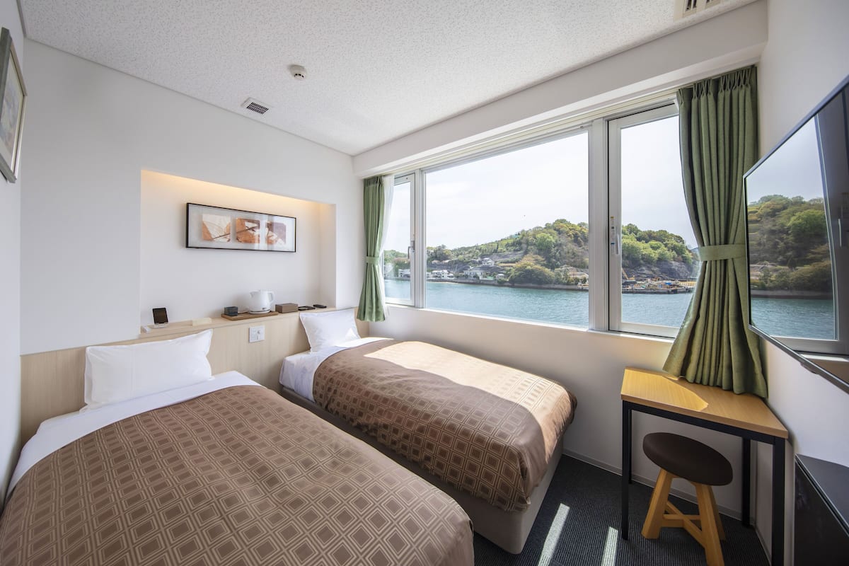 Chambre avec lits jumeaux | 1 chambre, Wi-Fi gratuit, draps fournis