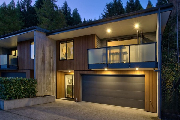 Front view of house, parking in front of the garage door.