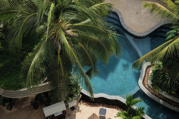 Outdoor pool, open 7:00 AM to 10:30 PM, free cabanas, pool umbrellas