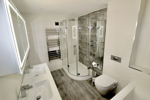 Bathtub, hair dryer, towels, soap