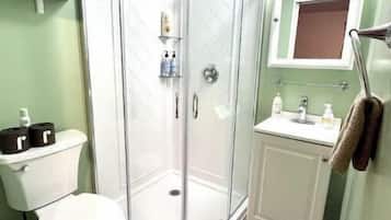 Shower, towels, soap, toilet paper