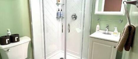 Shower, towels, soap, toilet paper