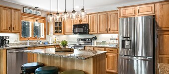 Condo at waterfront resort with golf course views, central AC, W/D, & pool