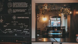A cozy bar area with a map of the Cromford Canal, featuring locations like Bullbridge and Pye Bridge. - The Canal Inn (Belper)