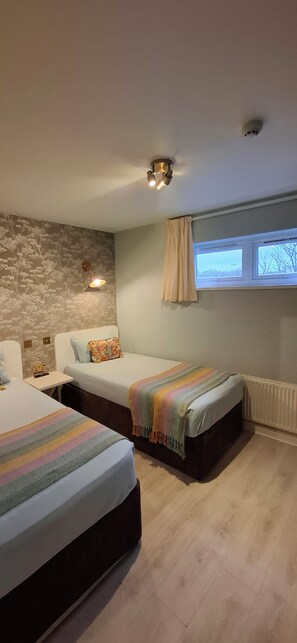 Family Quadruple Room, 2 Bedrooms | Hypo-allergenic bedding, in-room safe, individually furnished, desk