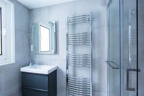 Shower, hair dryer, towels, soap