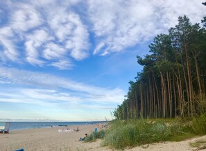 On the beach, sun-loungers, beach towels