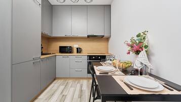 Apartment, 1 Bedroom, Balcony | Private kitchen | Electric kettle, cookware/dishes/utensils, dining tables