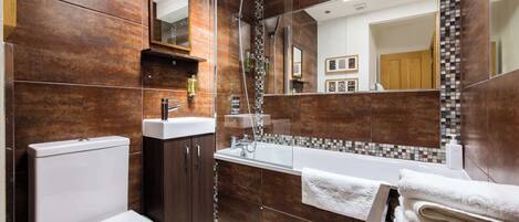 Shower, hair dryer, towels, shampoo