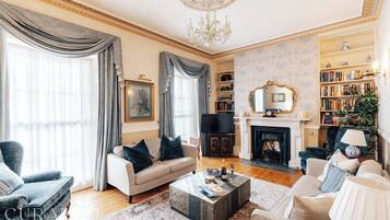 TV, fireplace, books, offices