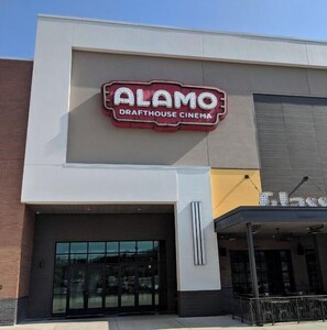 Experience the iconic Alamo Drafthouse Cinema, featuring a striking marquee sign and sleek architectural design.