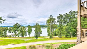 A view from a balcony overlooking a lake with trees and a road. - Pool & Boat Dock! Logan Martin Lake Extended Stay (Talladega)