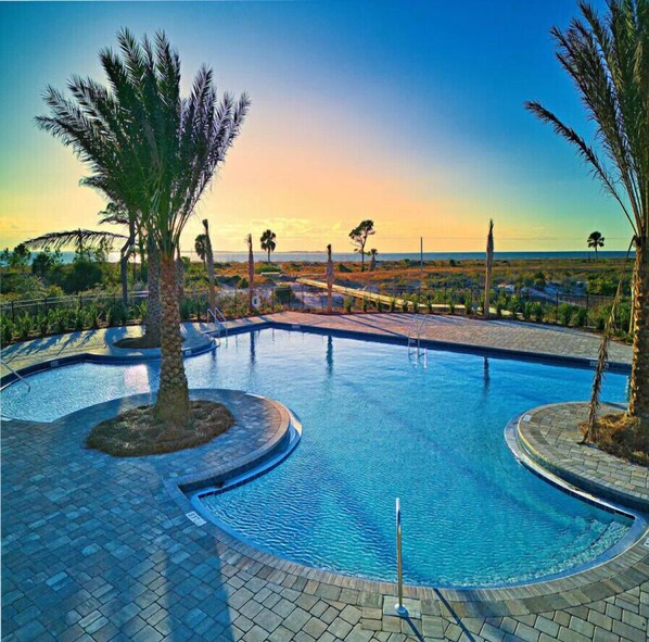Relax by the pool surrounded by lush vegetation and take in the breathtaking views of the surrounding landscape.