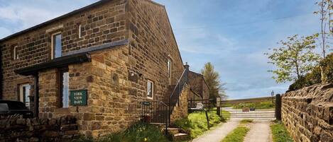A stone building with a sign reading 'York View Barn.'