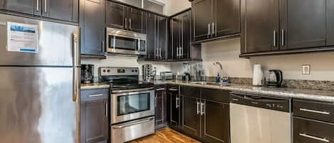 Signature Condo | Private kitchen | Fridge, microwave, oven, stovetop