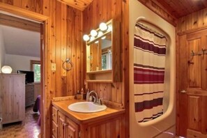 Bathtub, hair dryer, towels