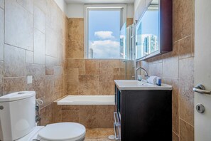 Bathtub, hair dryer, towels