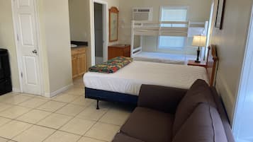 Family Studio, Non Smoking, Patio | Living area | 32-inch Smart TV with digital channels, TV