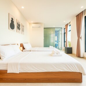 ห้องซูพีเรียทริปเปิล | ผ้าปูที่นอนฝ้ายอียิปต์, เครื่องนอนระดับพรีเมียม, มินิบาร์