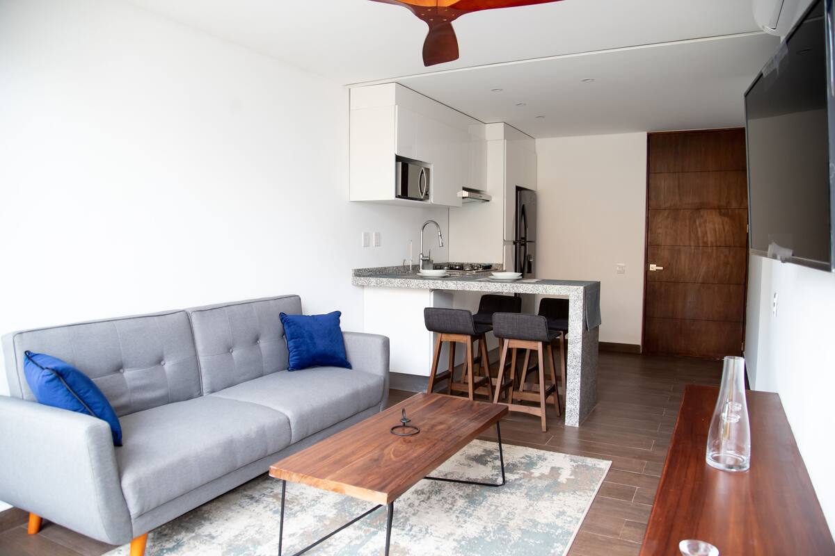 Comfort Apartment, 2 Bedrooms, Balcony, Pool View | Living area | 43-inch flat-screen TV with digital channels, TV