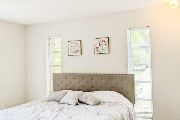 Bedroom #1: King size bed with a chair