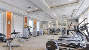 A well-lit gym with treadmills, weight machines, and free weights. - All the best family comforts at this very popular 5 bedroom home (Davenport)