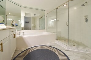 Shower, hair dryer, towels, toilet paper
