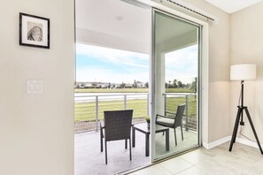 Relax in this serene space with a single chair and table, perfect for reading or unwinding.